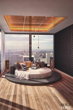 Ascetycznie urządzona sypialnia z nowoczesnym okrągłym łóżkiem